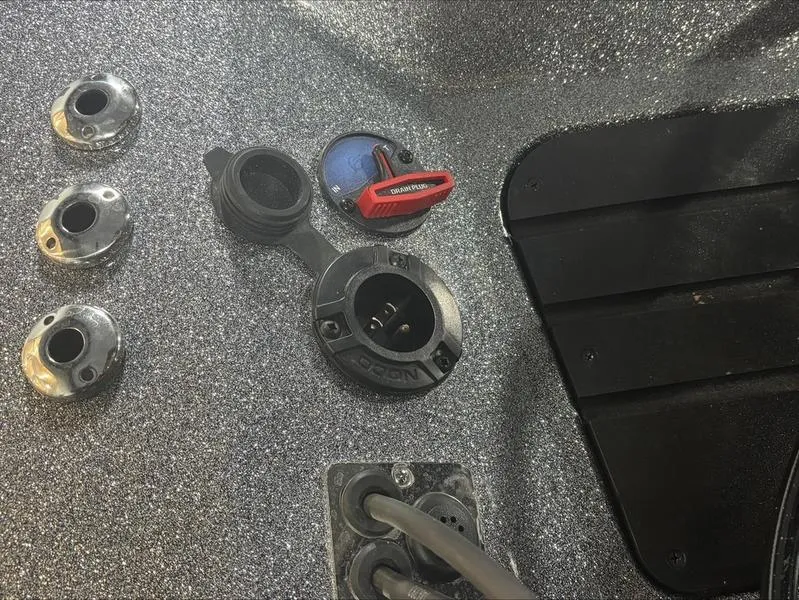 Slide: The Image of 2024 Ranger Z 521 R CUP ED boat dashboard with controls and connectors. - 12