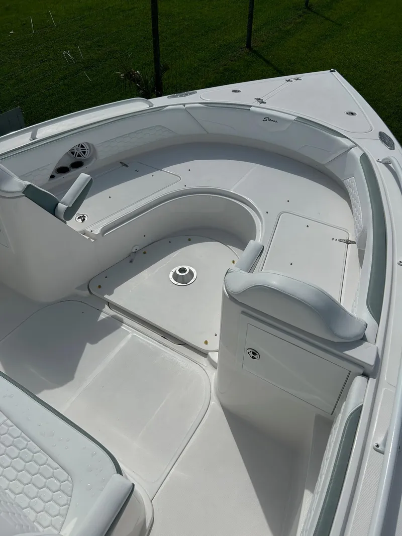 Slide: The Image of 2022 Stamas 33T Aventura boat deck with seating and storage. - 10