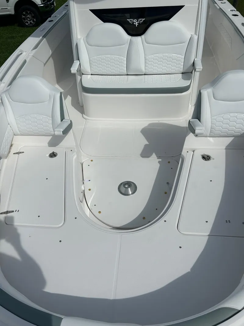 Slide: The Image of 2022 Stamas 33T Aventura boat interior with white seating and deck. - 11