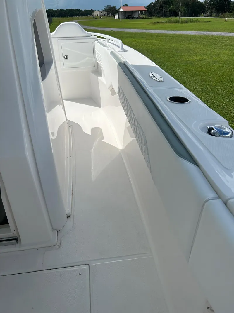 Slide: The Image of 2022 Stamas 33T Aventura boat deck, white finish, outdoor setting. - 4