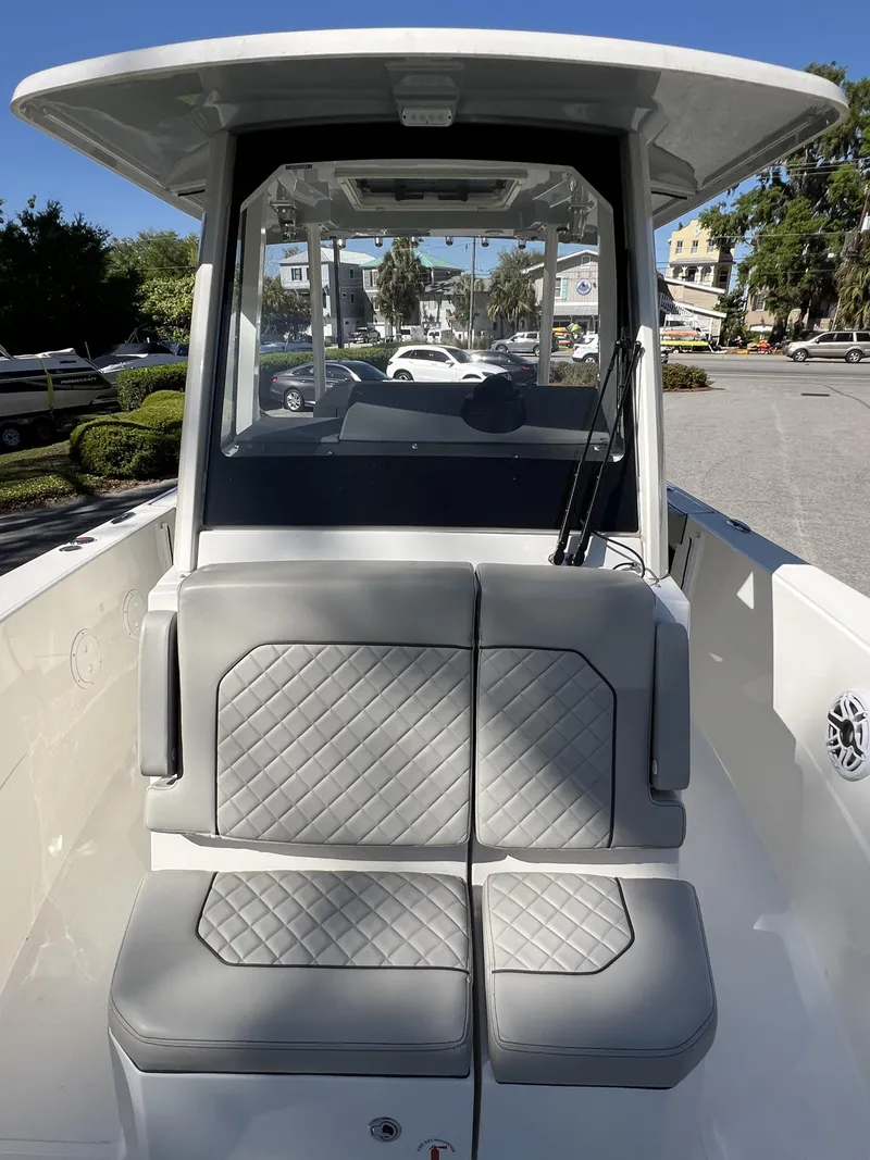 Slide: The Image of 2023 Pursuit S 288 boat with cushioned seating and modern design. - 22