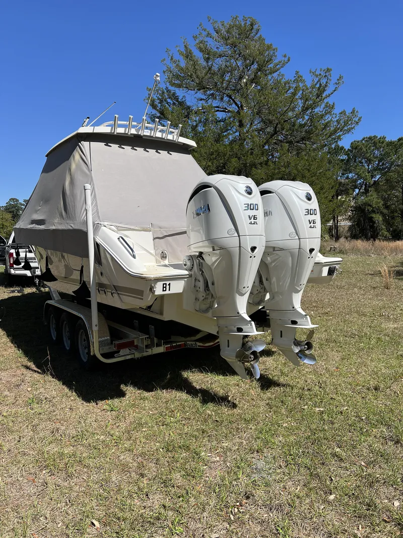 Slide: The Image of 2023 Pursuit S 288 boat with twin Yamaha 300 V6 engines on trailer. - 25