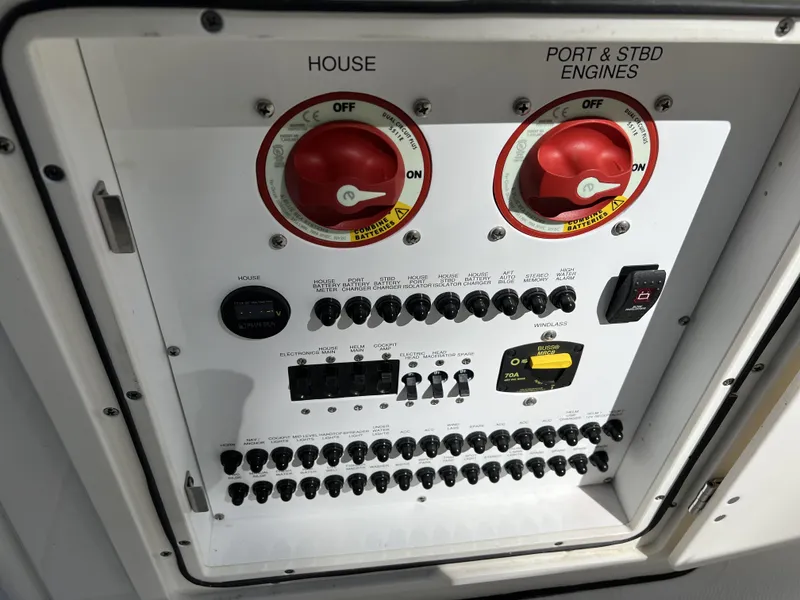 Slide: The Image of Control panel of 2023 Pursuit S 288 boat with switches and dials. - 36