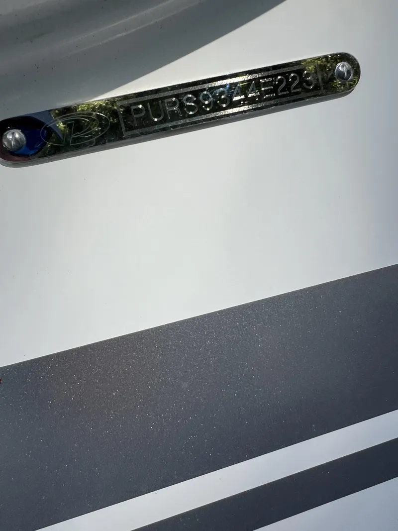 Slide: The Image of 2023 Pursuit S 288 boat identification plate with serial number. - 38