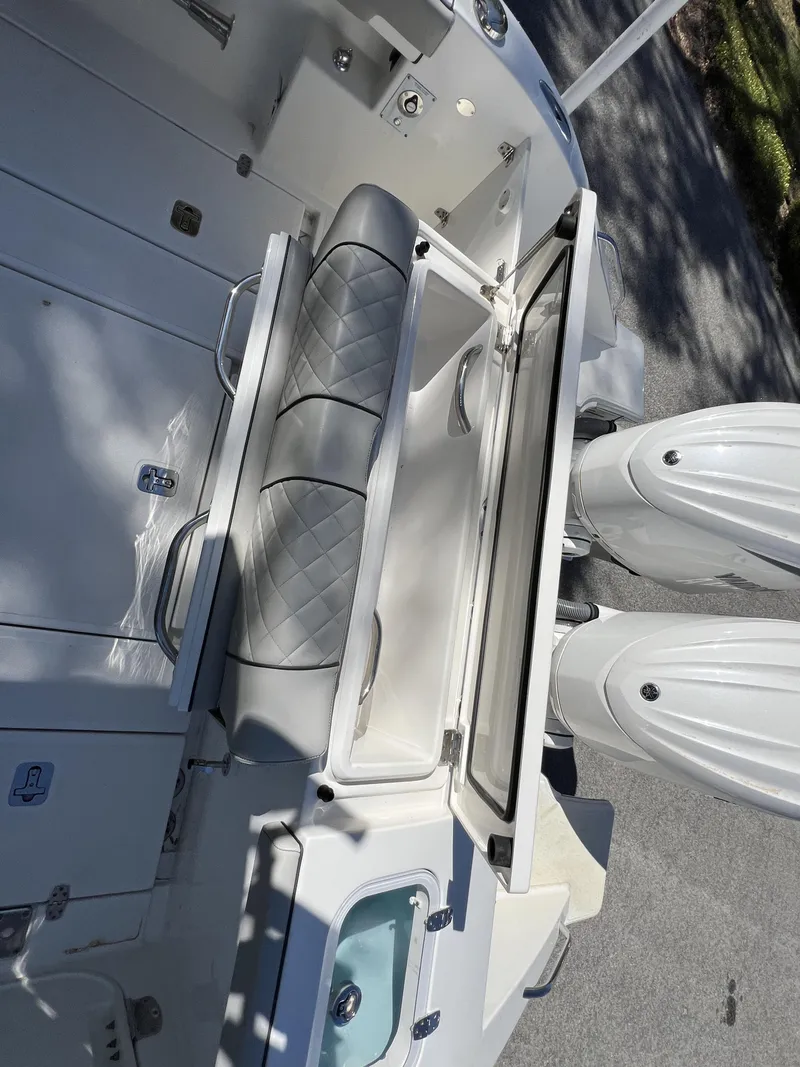 Slide: The Image of 2023 Pursuit S 288 boat interior with dual engines and seating. - 7