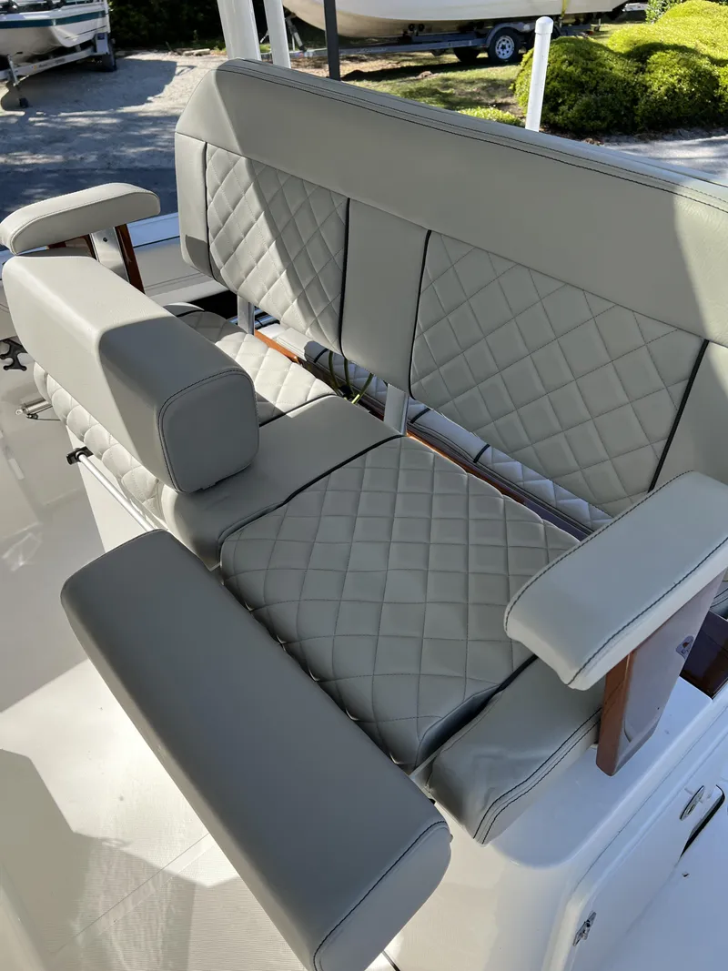 Slide: The Image of 2023 Pursuit S 288 boat seating with quilted gray upholstery. - 8