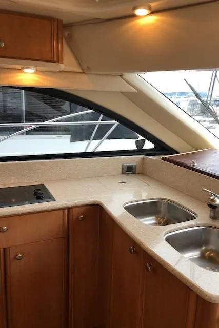 Slide: The Image of 2003 Meridian 411 yacht kitchen with dual sinks and modern design. - 13