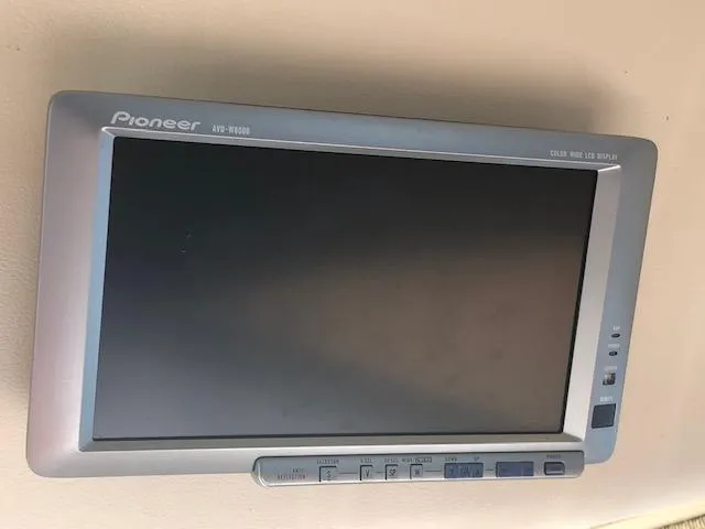 Slide: The Image of Pioneer AVH-W6000 display screen, wall-mounted, with control buttons, 2003 Meridian 411 model. - 26