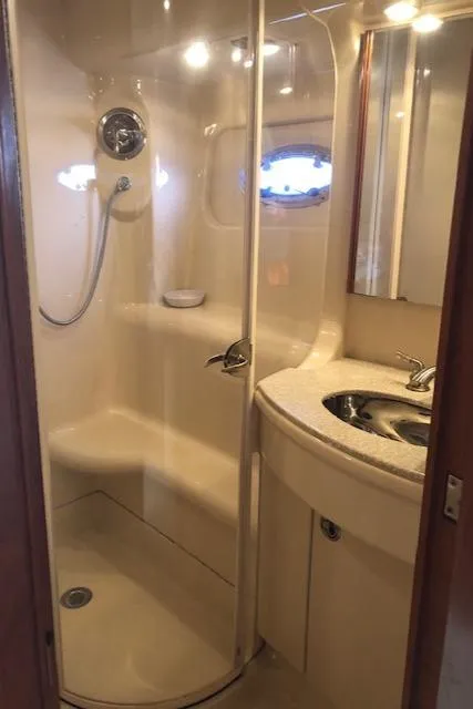 Slide: The Image of 2003 Meridian 411 yacht bathroom with shower, sink, and modern fixtures. - 39