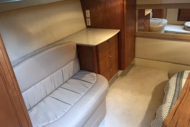 Slide: The Image of Luxurious interior of 2003 Meridian 411 yacht with plush seating and wooden cabinetry. - 43