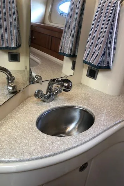 Slide: The Image of 2003 Meridian 411 yacht bathroom with sleek sink and modern fixtures. - 48