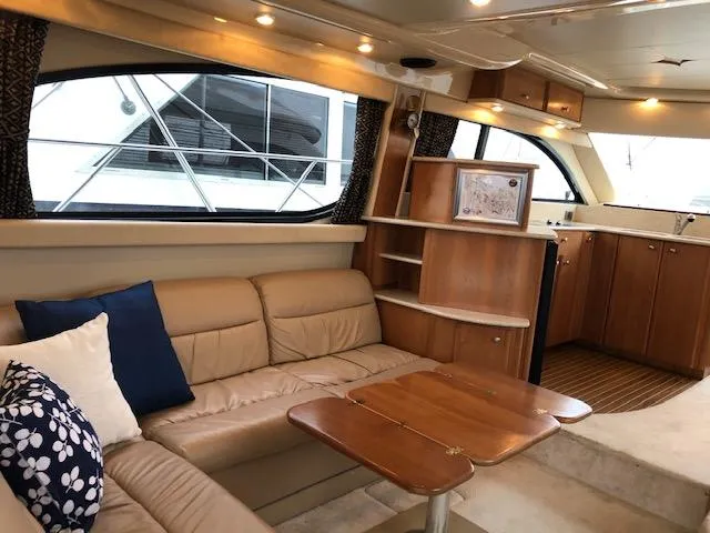 Slide: The Image of Luxurious interior of a 2003 Meridian 411 yacht with leather seating and wooden accents. - 7