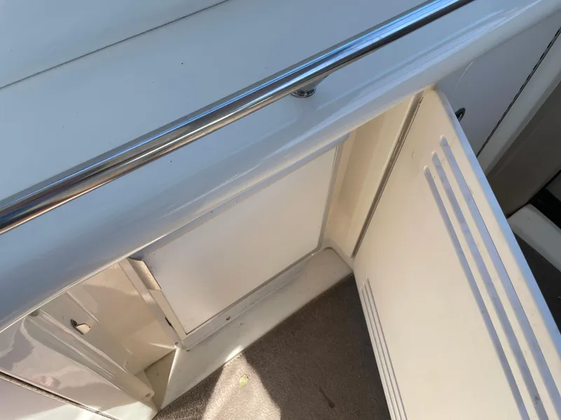 Slide: The Image of Open storage compartment on 2001 Sea Ray 380 Sundancer boat. - 13