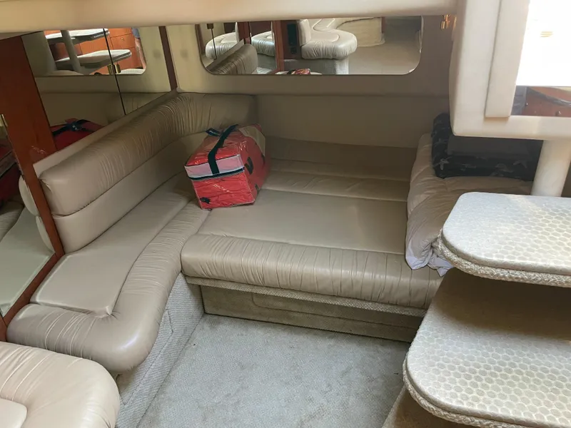 Slide: The Image of Interior of 2001 Sea Ray 380 Sundancer with beige seating and red bag. - 14