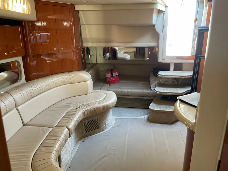 Slide: The Image of Luxurious interior of 2001 Sea Ray 380 Sundancer yacht with leather seating and wood cabinetry. - 20