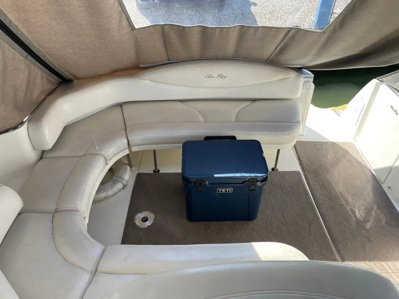 Slide: The Image of Interior of 2001 Sea Ray 380 Sundancer with Yeti cooler on carpeted floor. - 7