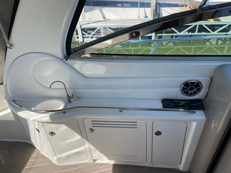Slide: The Image of 2001 Sea Ray 380 Sundancer interior with sink and storage cabinets. - 9