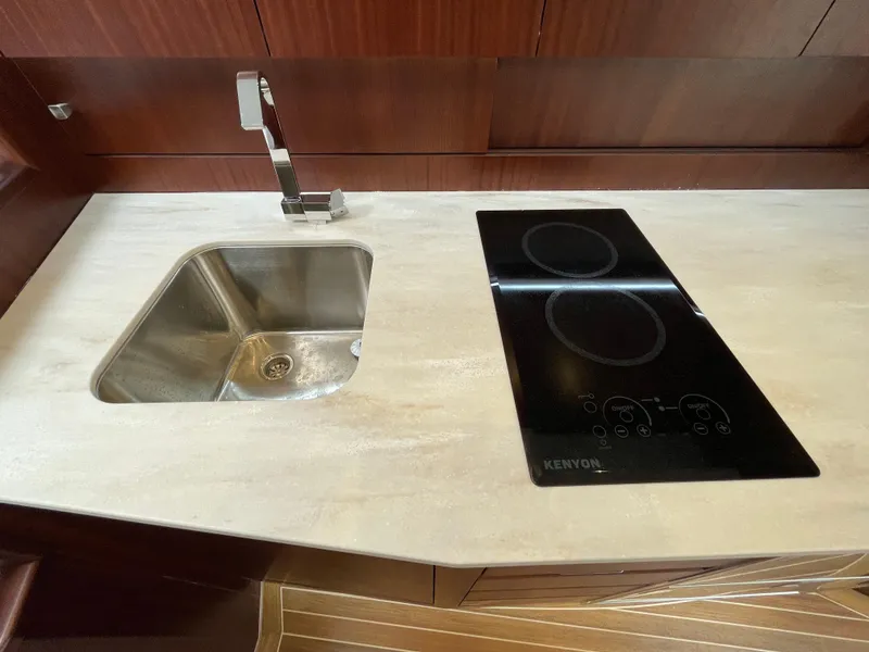 Slide: The Image of Modern kitchen in 2021 Jupiter 41 SB yacht with sink and stovetop. - 11