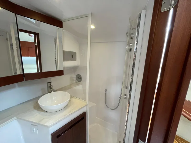 Slide: The Image of Luxurious bathroom in 2021 Jupiter 41 SB yacht with modern fixtures and elegant design. - 12