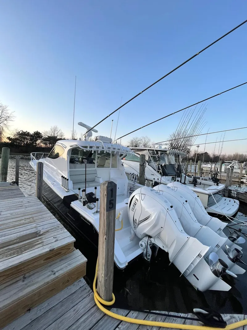 Slide: The Image of 2021 Jupiter 41 SB boat docked at marina during sunset. - 19