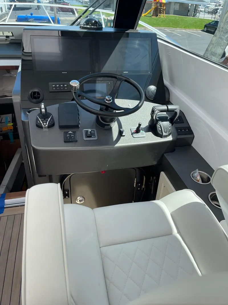 Slide: The Image of 2021 Jupiter 41 SB helm with modern controls and steering wheel. - 4