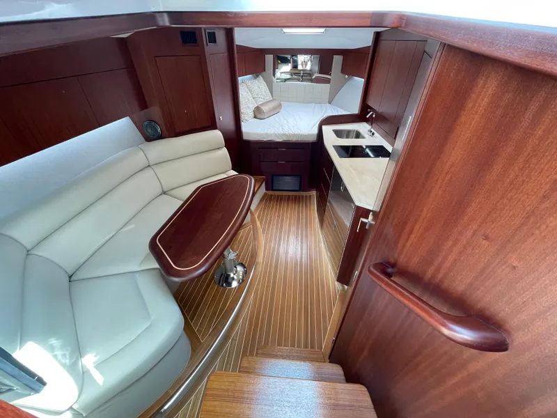 Slide: The Image of Luxurious interior of 2021 Jupiter 41 SB yacht with wood finish and cozy seating. - 6