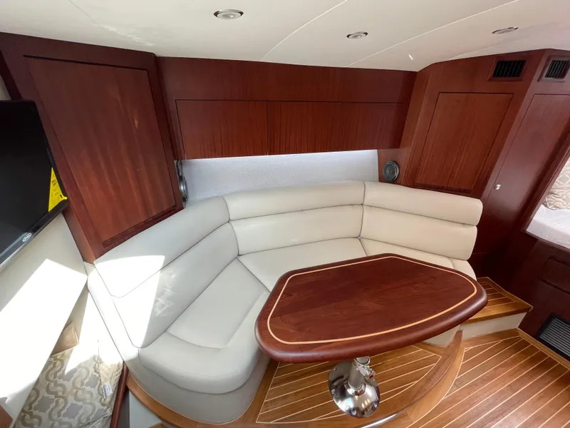 Slide: The Image of Luxurious interior of 2021 Jupiter 41 SB yacht with elegant seating and wooden table. - 7