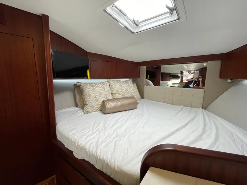 Slide: The Image of Luxurious cabin interior of 2021 Jupiter 41 SB yacht with skylight and cozy bedding. - 9