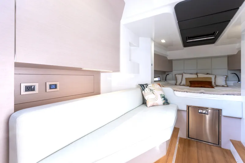 Slide: The Image of Interior of the 2025 SACS Rebel 47 with sleek seating area and modern design. - 44
