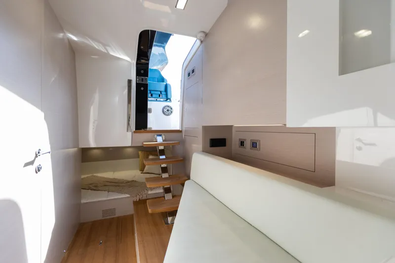Slide: The Image of Interior of the 2025 SACS Rebel 47 with modern wood flooring and white walls. - 41