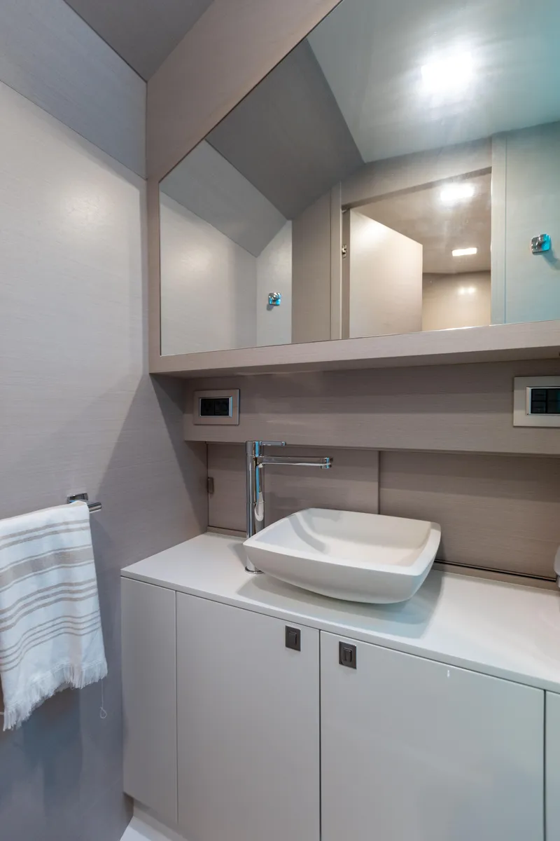 Slide: The Image of Modern bathroom with white sink, mirrors, and towel holder. - 50
