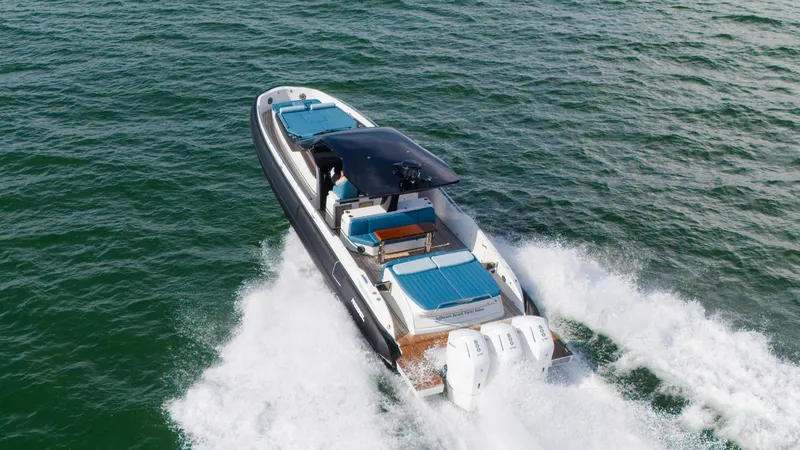 Slide: The Image of The image shows a modern speedboat cruising swiftly over the water. - 17