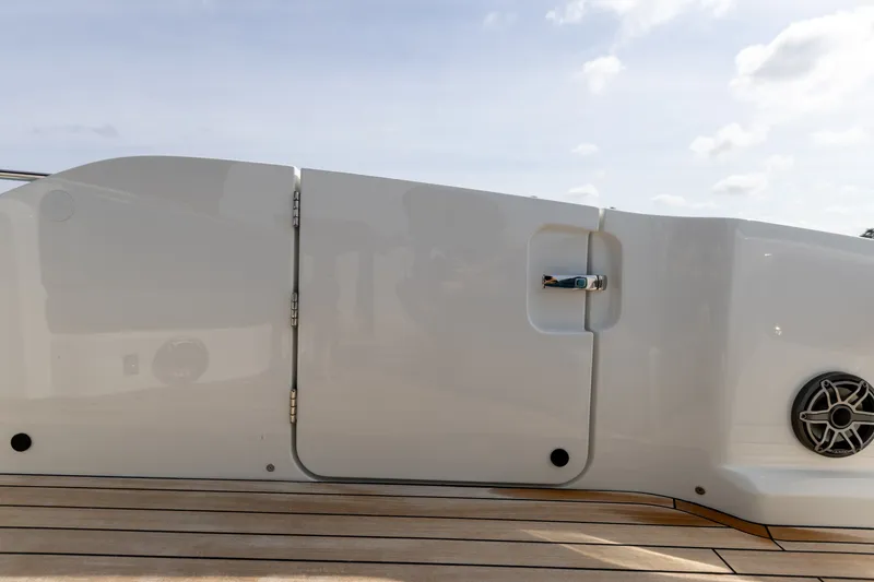 Slide: The Image of The 2025 SACS Rebel 47 features a sleek white side panel with a speaker. - 40
