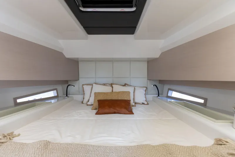 Slide: The Image of Cabin of the 2025 SACS Rebel 47 with a cozy bed and modern accents. - 46