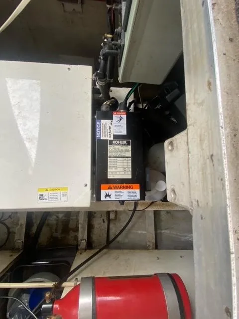 Slide: The Image of Kohler generator in 1985 Arc houseboat engine room with fire extinguisher. - 21