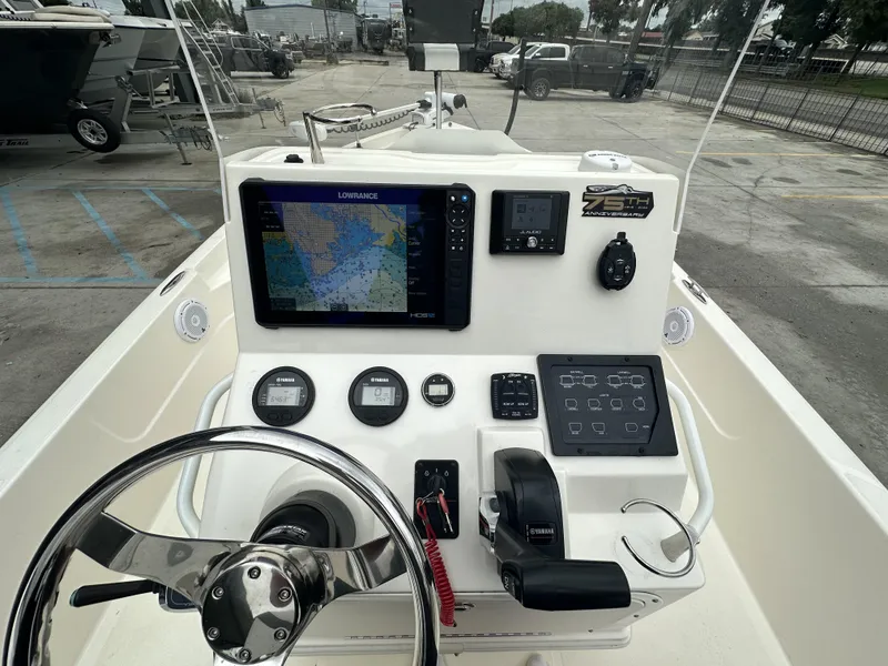 Slide: The Image of 2023 Skeeter SX230 boat dashboard with navigation and control systems. - 13
