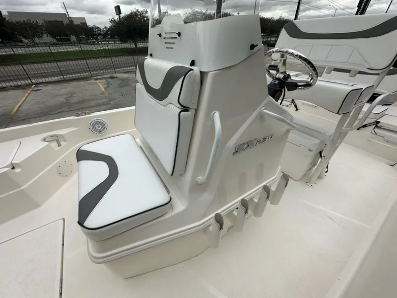 Slide: The Image of 2023 Skeeter SX230 boat interior with white seating and steering console. - 8