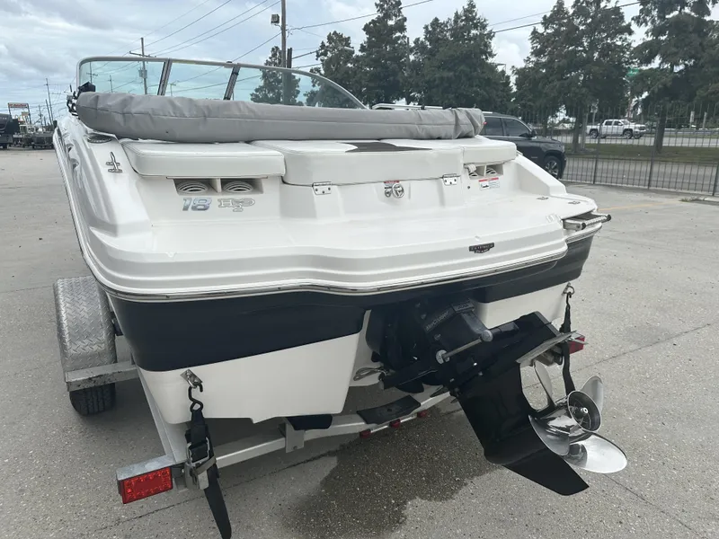 Slide: The Image of 2012 Chaparral 18 H2O Sport boat on trailer, rear view with outboard motor. - 11