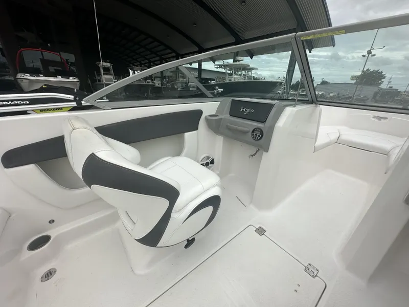 Slide: The Image of Interior of 2012 Chaparral 18 H2O Sport boat with white seating and dashboard. - 3