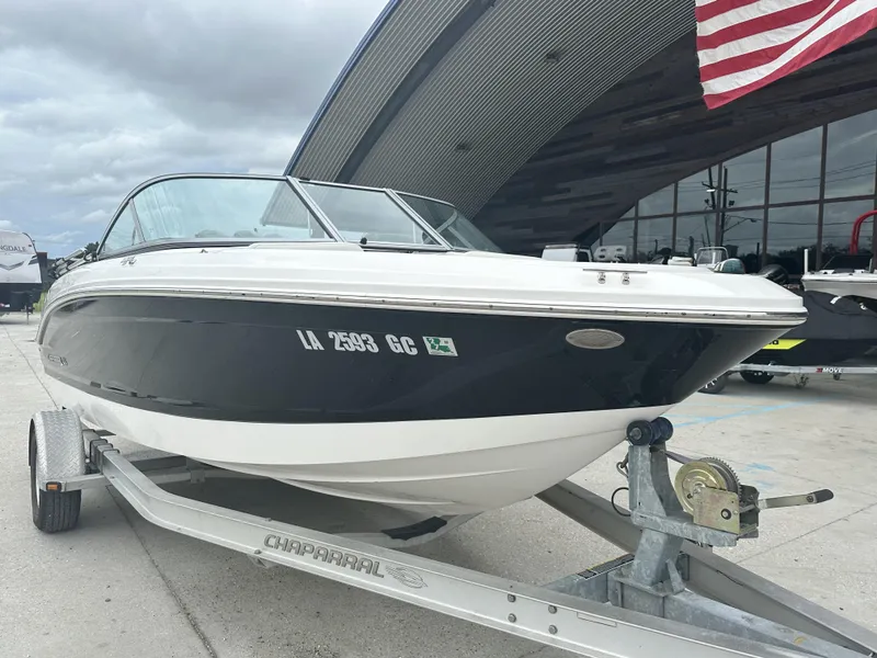Slide: The Image of 2012 Chaparral 18 H2O Sport boat on trailer, parked outdoors. - 5