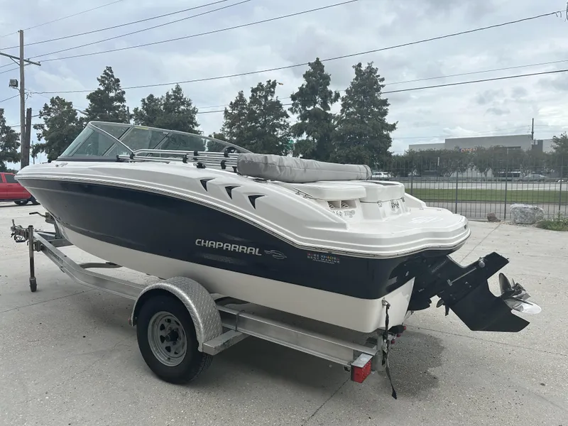 Slide: The Image of 2012 Chaparral 18 H2O Sport boat on trailer, parked outdoors. - 6