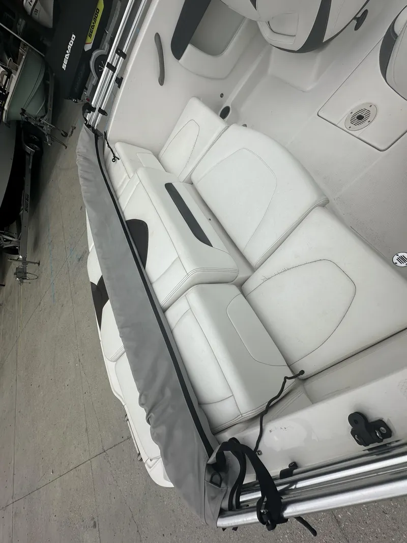 Slide: The Image of Interior of a 2012 Chaparral 18 H2O Sport boat with white seating. - 7