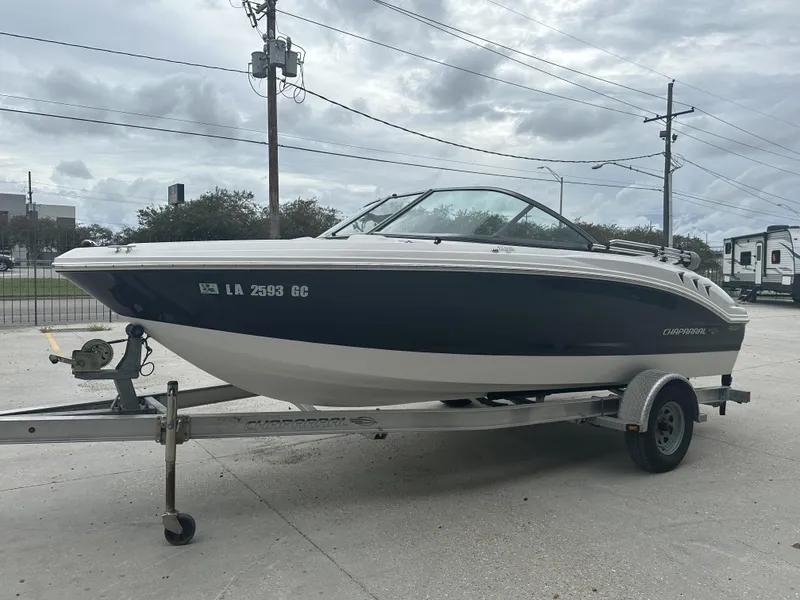 Slide: The Image of 2012 Chaparral 18 H2O Sport boat on trailer, parked outdoors. - 9