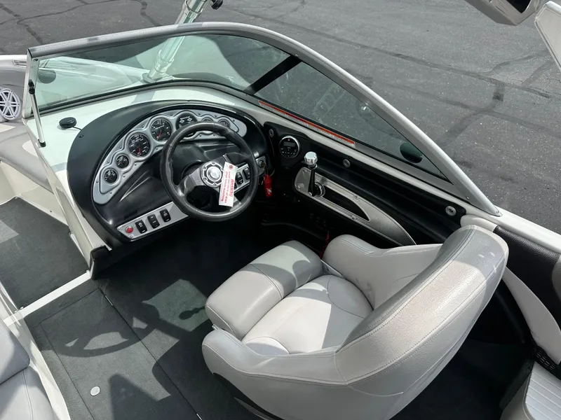 Slide: The Image of Interior of a 2008 MasterCraft X-1 boat with steering console. - 10