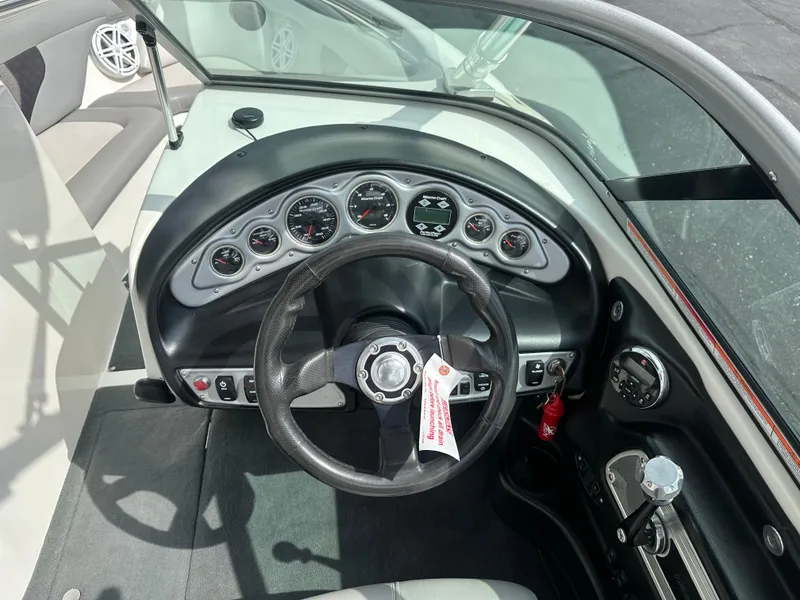 Slide: The Image of Interior view of a 2008 MasterCraft X-1 boat dashboard. - 11