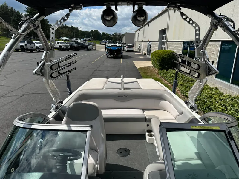 Slide: The Image of Interior view of a 2008 MasterCraft X-1 boat on a parking lot. - 17