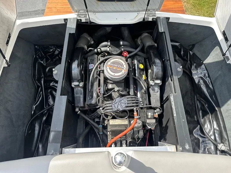 Slide: The Image of Engine compartment of a 2008 MasterCraft X-1 boat, showcasing the engine. - 18