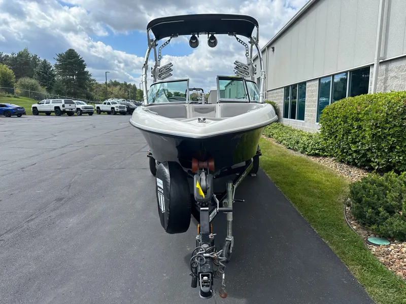 Slide: The Image of 2008 MasterCraft X-1 boat on trailer in front of building. - 3