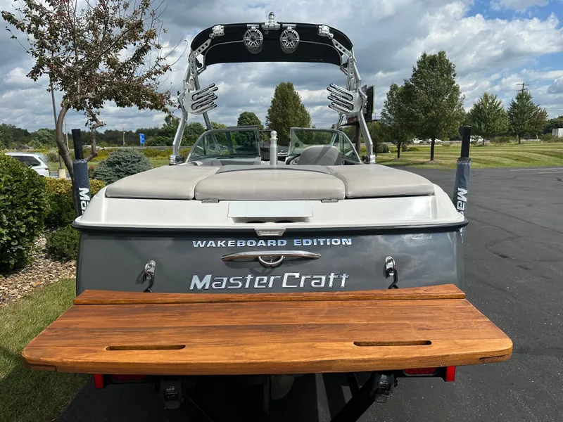 Slide: The Image of 2008 MasterCraft X-1 Wakeboard Edition boat in parking lot. - 6
