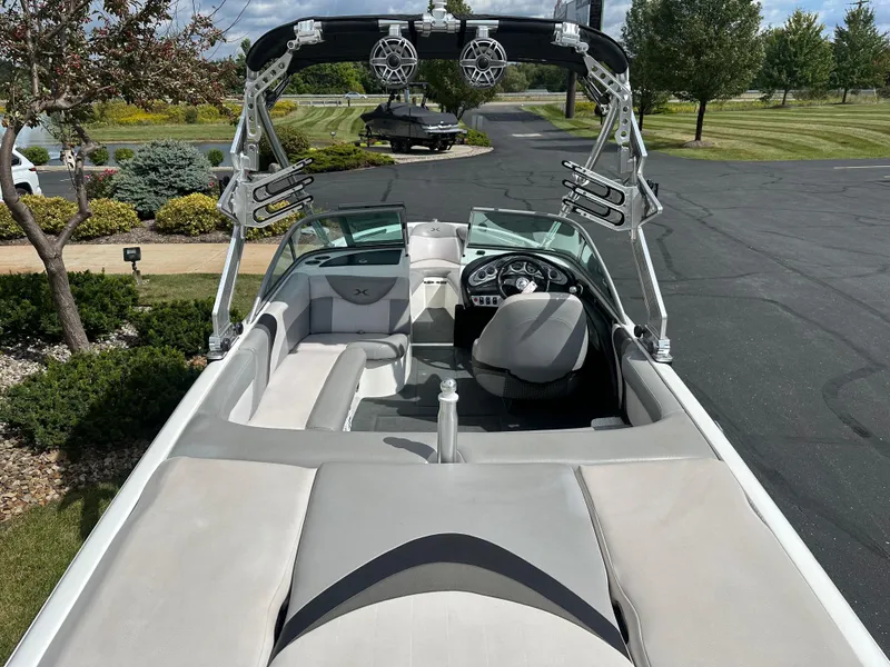Slide: The Image of Interior view of a 2008 MasterCraft X-1 boat on a parking lot. - 8